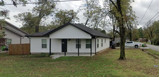 White single-story home with covered front porch