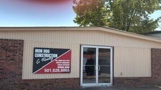 Iron Hog Construction & Realty office building with company sign